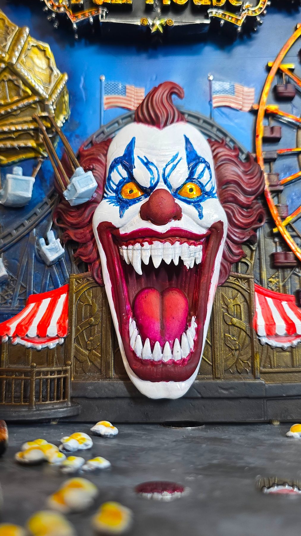 Painted clown face from the fun house diorama