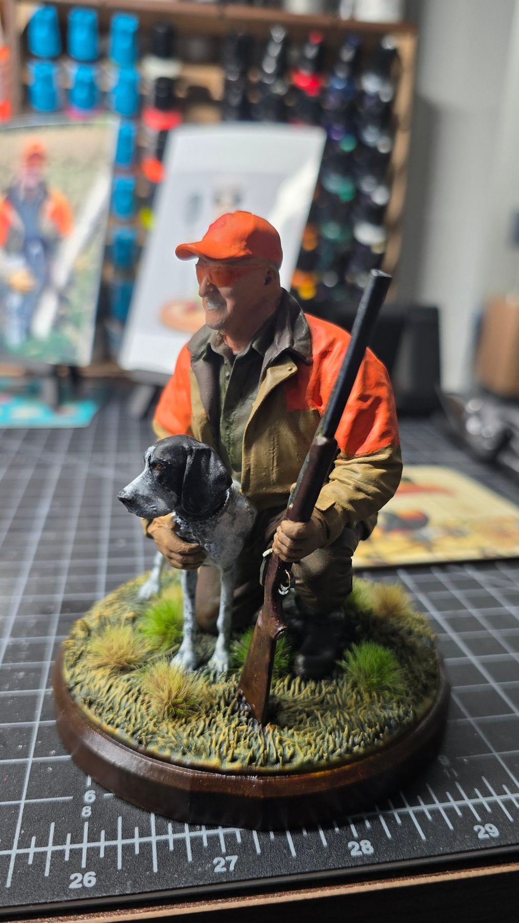 Kneeling hunter with his pointer dog, fully painted