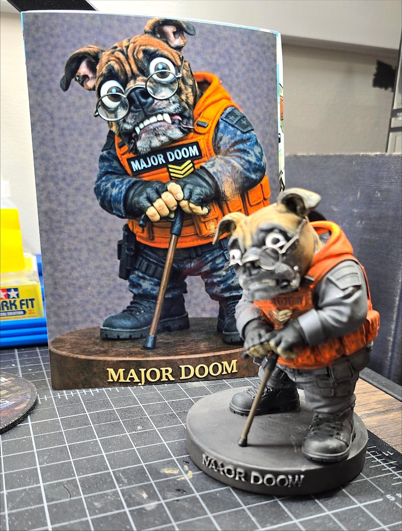 Major Doom bulldog figurine beside its artwork